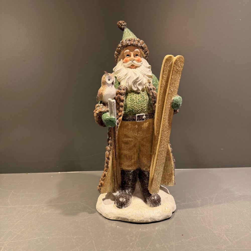 Kerstman met ski's groen